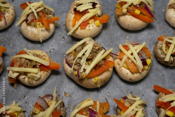 Obraz Stuffed mushrooms on baking paper
