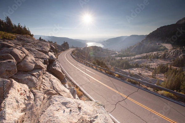 Obraz Mountain road with lake in background