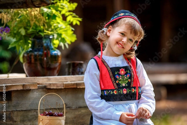 Fototapeta Adorable little girl in Swedish traditional clothes during Midsommar festival