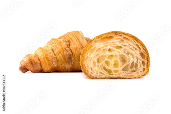 Fototapeta Plain Croissants and cut in half, showing the cross section, a classic crescent-shaped croissant. isolated on a white background.