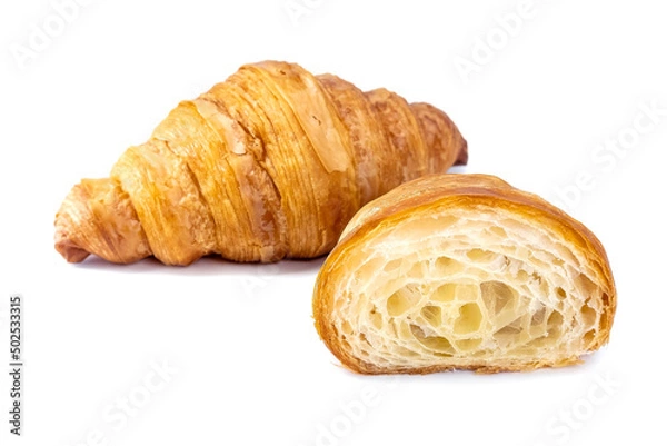 Fototapeta Plain Croissants and cut in half, showing the cross section, a classic crescent-shaped croissant. isolated on a white background.