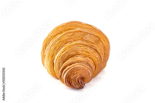Fototapeta Plain Croissant on the side shows the streaks of the dough, a classic crescent-shaped croissant. isolated on a white background.