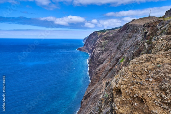 Fototapeta Rocky coast of Madeira with cliffs, coast of the island