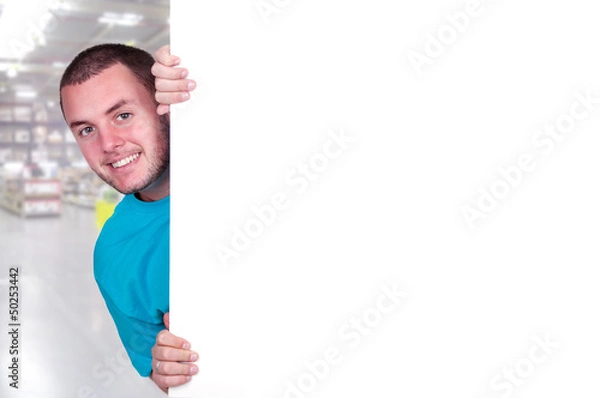 Fototapeta Jeune homme derrière un tableau blanc.