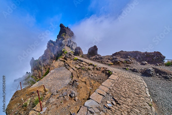 Fototapeta Mountain trek to the Pico Ruivo mountains from Pico Arieiro, highest mount, tropical nature, dangerous travel