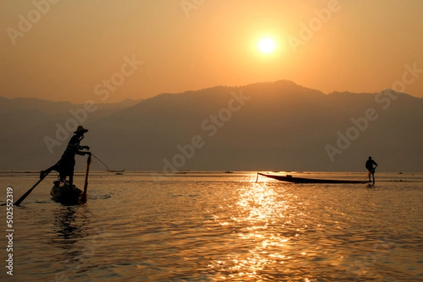 Fototapeta  Leg-rowing fishermen at sunrise on Inle Lake Burma
