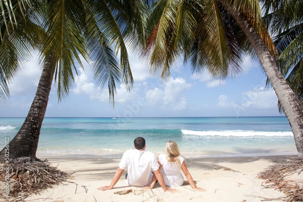 Obraz couple sitting on the beach