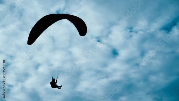 Obraz Silhouette of a skydiver in the sky
