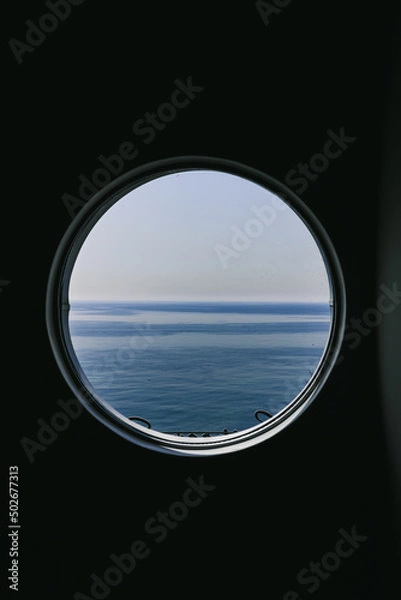 Obraz View of sea from the round window