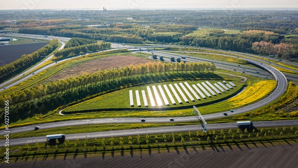 Obraz Solar panels in the middle of a highway intersection in Almere, Netherlands