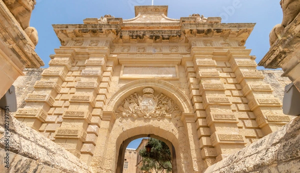 Fototapeta Old sandstone entry gate to the excapital of Malta, known also from "Game of Thrones".