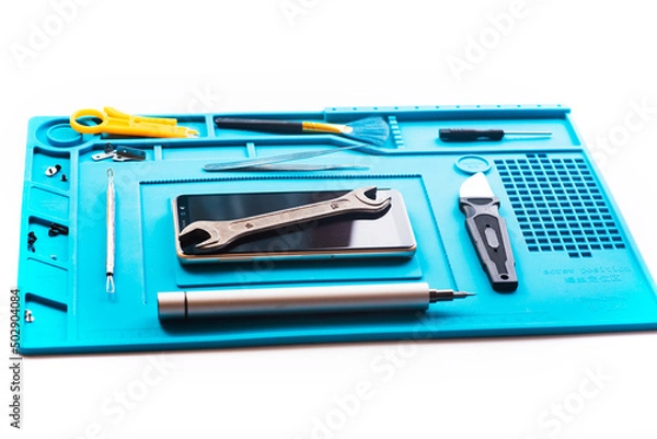 Fototapeta Flat lay image of dismantling the broken smart phone for preparing to repair or replace some components, Top view