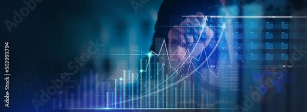 Obraz Businessman working with modern computer virtual dashboard analyzing finance sales data and economic growth graph chart and block chain technology.