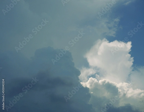 Fototapeta Cumulonimbus cloud formations on tropical blue sky , Nimbus moving , Abstract background from natural phenomenon and gray clouds hunk , Thailand