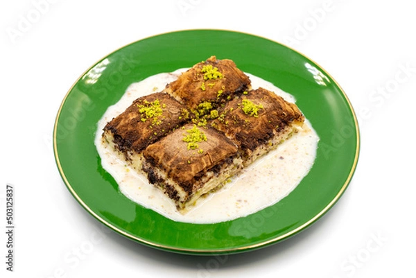 Fototapeta Dark chocolate baklava. Baklava with milk isolated on a white background. Mediterranean cuisine delicacies. Close-up. Local name bitter soguk baklava