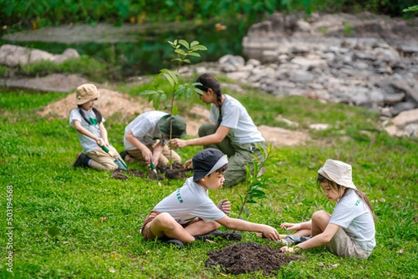 Obraz Children join as volunteers for reforestation, earth conservation activities to instill in children a sense of patience and sacrifice, doing good deeds and loving nature.