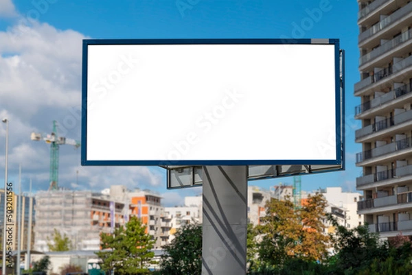 Obraz Advertising billboard mock-up on the residential area. There is construction site in the background