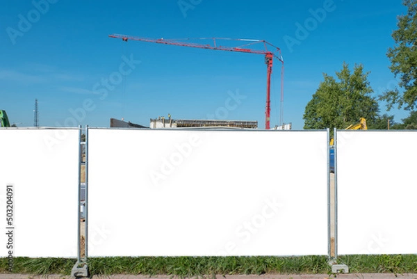 Obraz Advertising banner mock-up on the fence of construction site