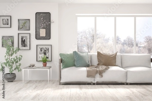 Fototapeta White living room with sofa and winter landscape in window. Scandinavian interior design. 3D illustration