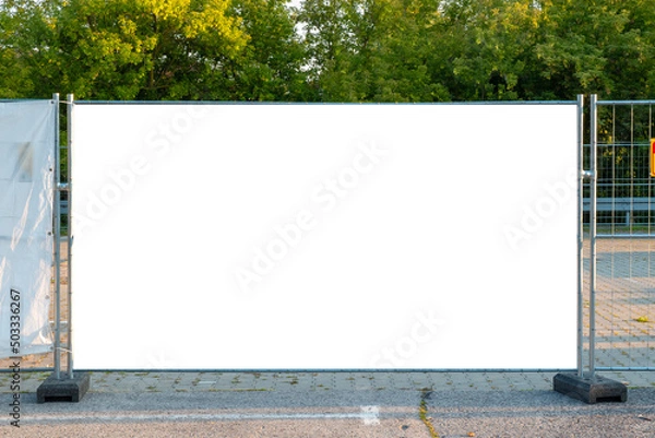 Obraz Blank white banner for advertisement on the fence of construction site