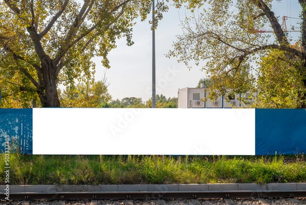 Obraz Blank white billboard for advertisement in front of the construction site