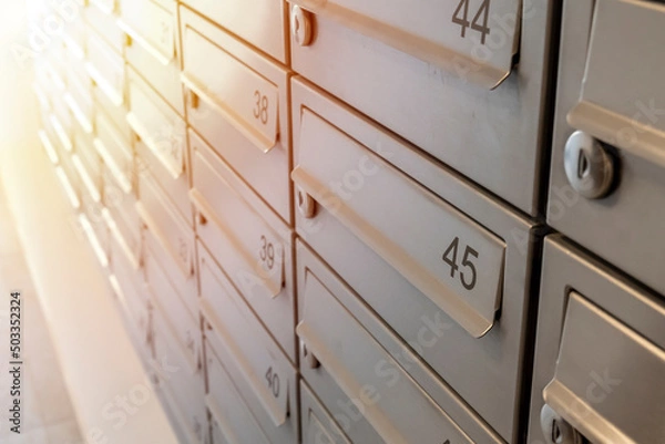 Obraz Close-up of metal mailboxes near the entrance in modern apartment building