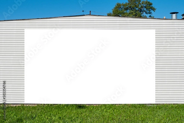 Obraz Blank white advertising billboard mounted on the wall of the building