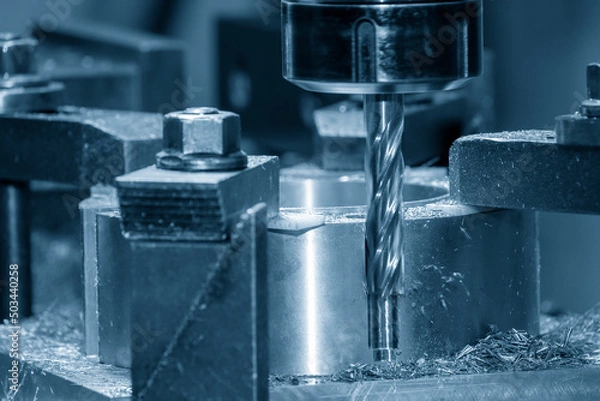 Fototapeta The drilling process on NC milling machine.