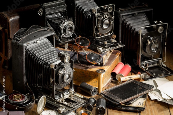 Fototapeta Old camera in the studio on an old background