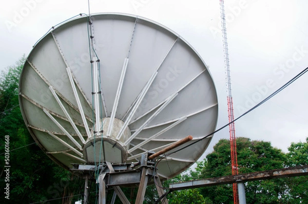 Obraz Behind a large satellite dish, natural background.
