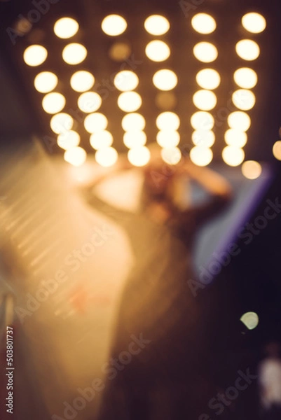 Obraz bokeh lights in the club with woman silhouette