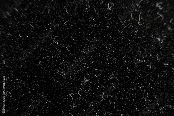 Fototapeta Artificial skin under high magnification with selective focus. Dark background with sewing material with small details.