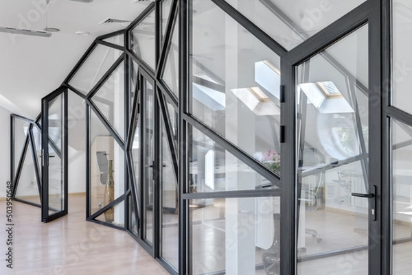 Obraz glass partition in a white office, window with black frame