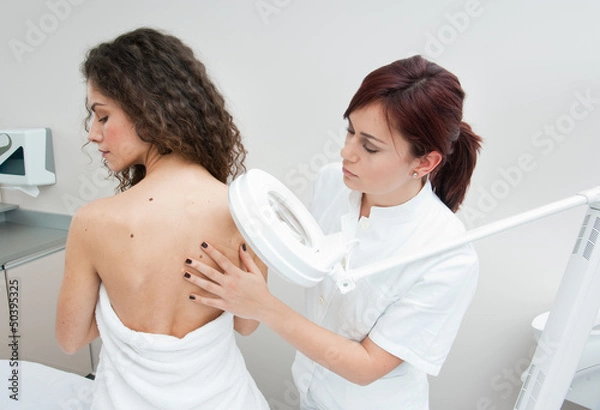 Fototapeta woman at dermatology examination