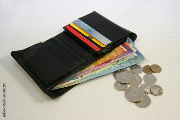 Fototapeta Leather wallet with swiss bank notes and coins