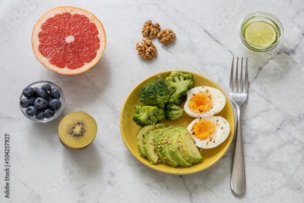 Fototapeta Minimalistic photo of healthy breakfast with foods to speed up metabolism. High quality photo