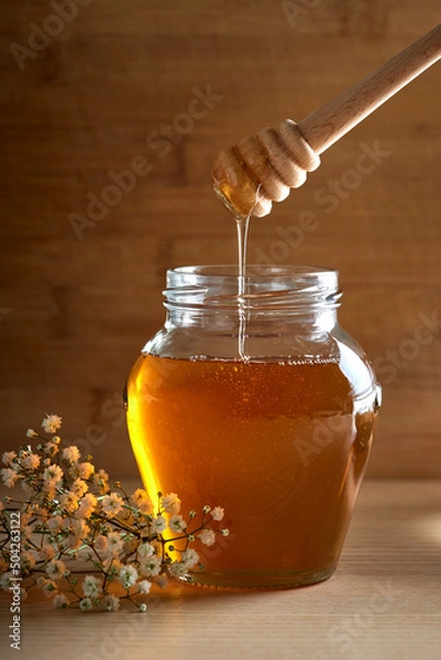 Fototapeta Fresh Honey in glass jar with dipper