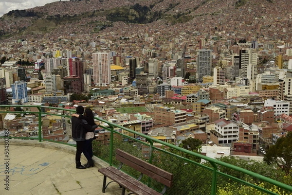 Fototapeta La Paz, Bolivia - 30 January 2017: Couple hugs on the observation deck. La Paz, Bolivia