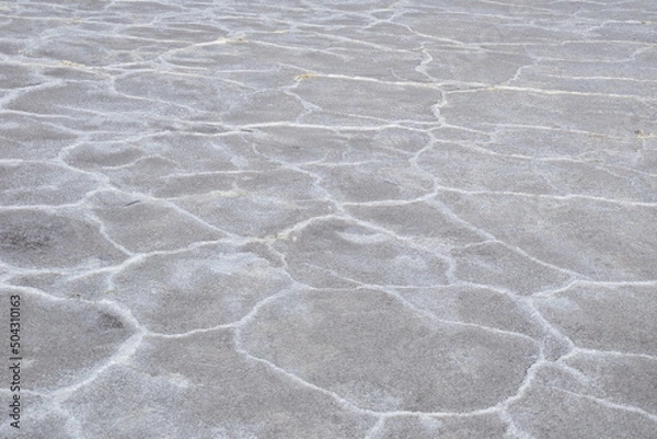 Fototapeta Drawing of dried salt on the surface of the lake Salar de Uyuni, Bolivia.