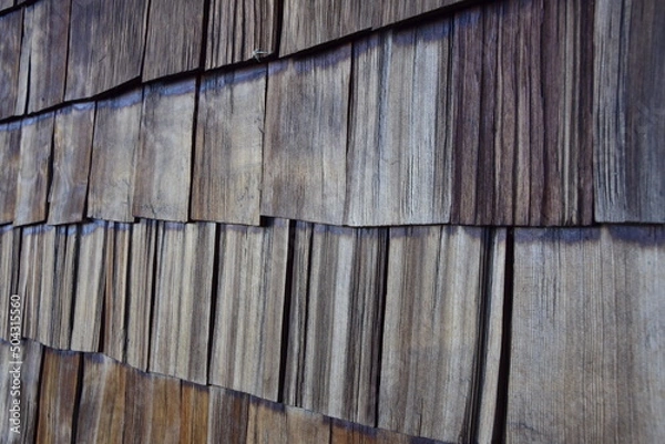 Fototapeta Old wooden tiles on the facade of the house. Puerto Varas, Chile.