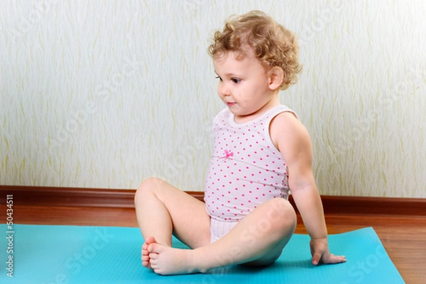 Obraz Cute little girl exercising in gym