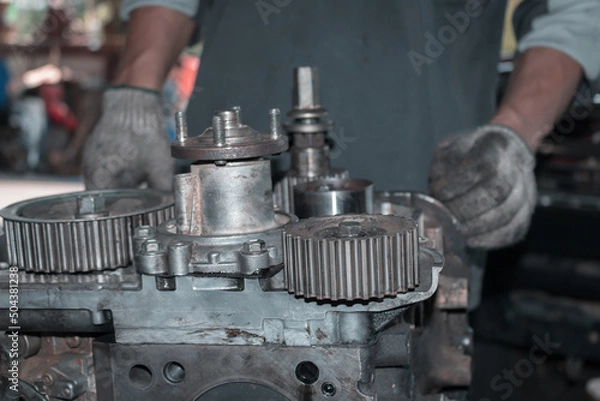 Fototapeta The mechanic is checking the engine.