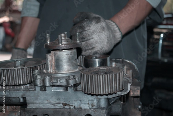 Obraz The mechanic is checking the engine.