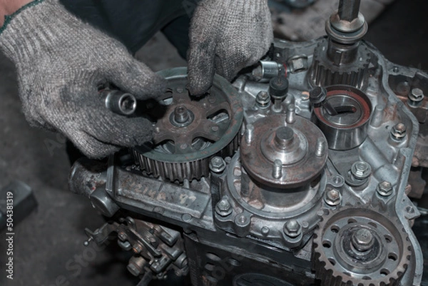 Obraz The mechanic is checking the engine.