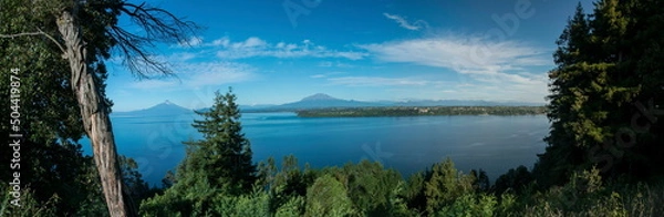 Fototapeta A landscape view of the Osorno and Calbuco volcano at sunrise by the Llanquihue Lake, Puerto Varas