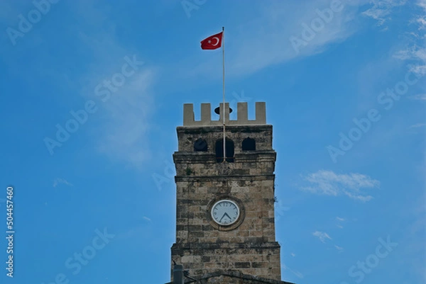 Obraz castle shaped clock tower in turkey, turkish flag