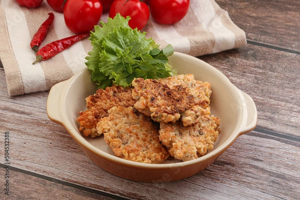 Fototapeta Fried salmonn cutlet in the bowl