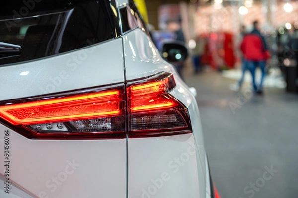 Fototapeta closeup of a red led taillight on a modern car, detail on the rear light of a car