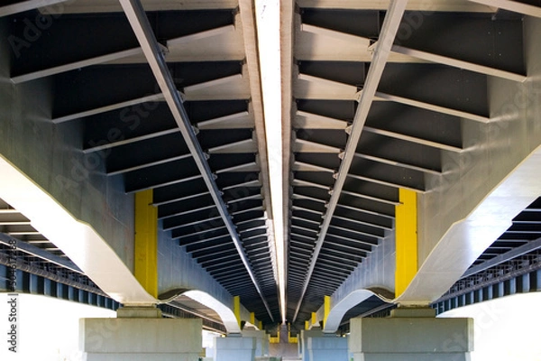 Fototapeta Framework under bridge. Grey metal and concrete modern design.