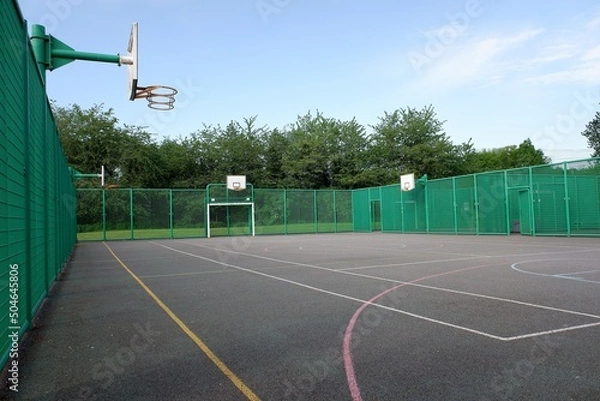 Obraz Multi-use sports court with basketball nets and football goals